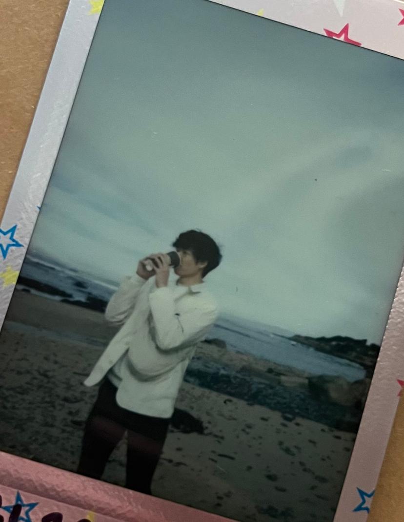 Wes drinking Philz on the beach